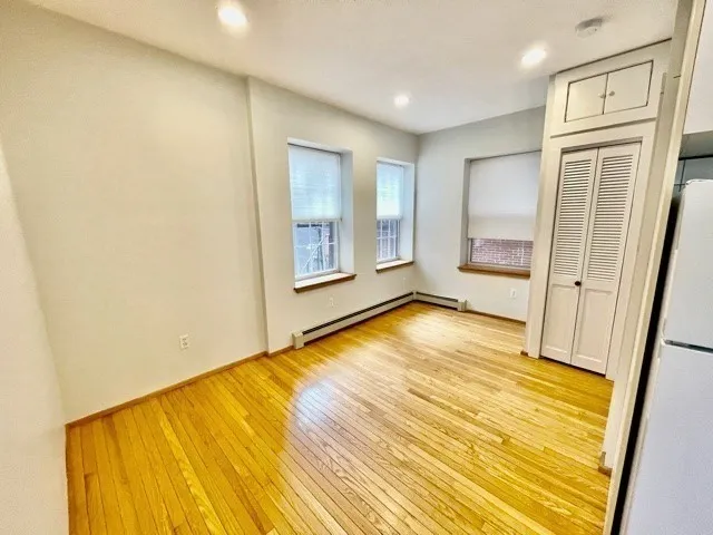 a kitchen with a refrigerator and a stove