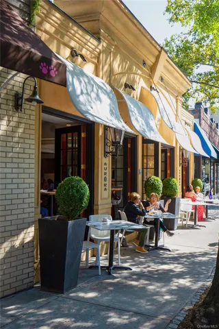 a building outdoor space with patio furniture and potted plants