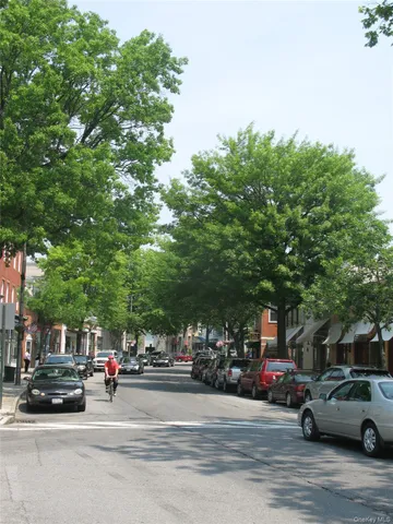 a view of street with parked cars