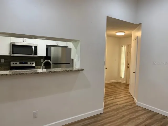 a view of a livingroom with wooden floor