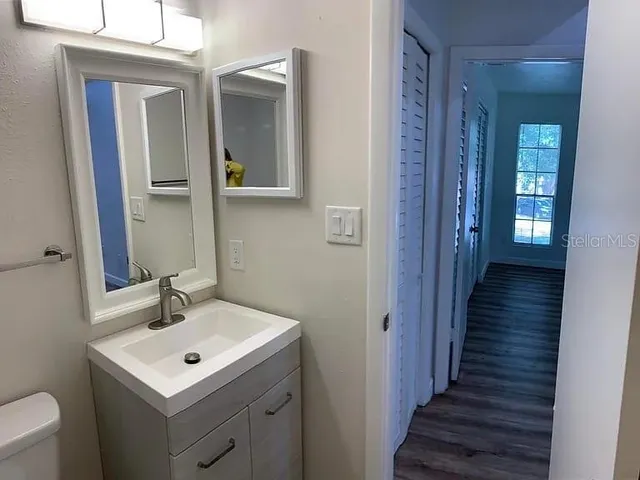 a bathroom with a sink and a mirror