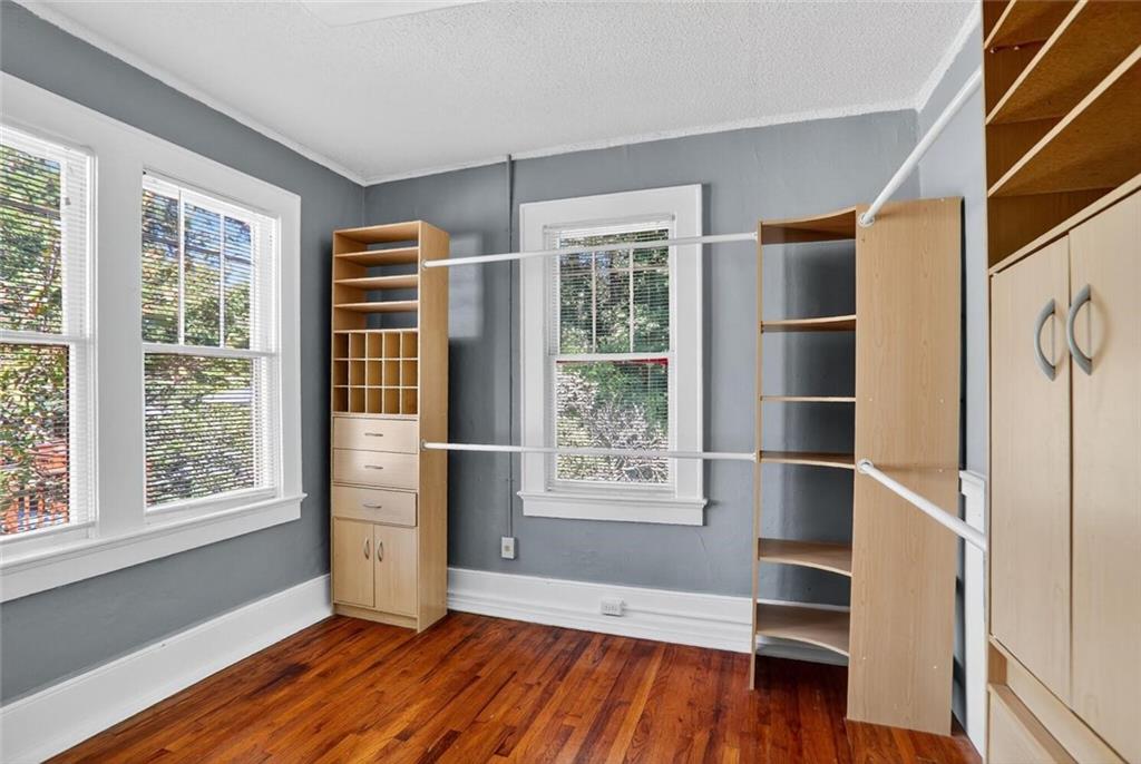 1497 North Morningside Drive Northeast Atlanta, GA 30306 - Photo 14 of 36 an empty room with wooden floor and windows