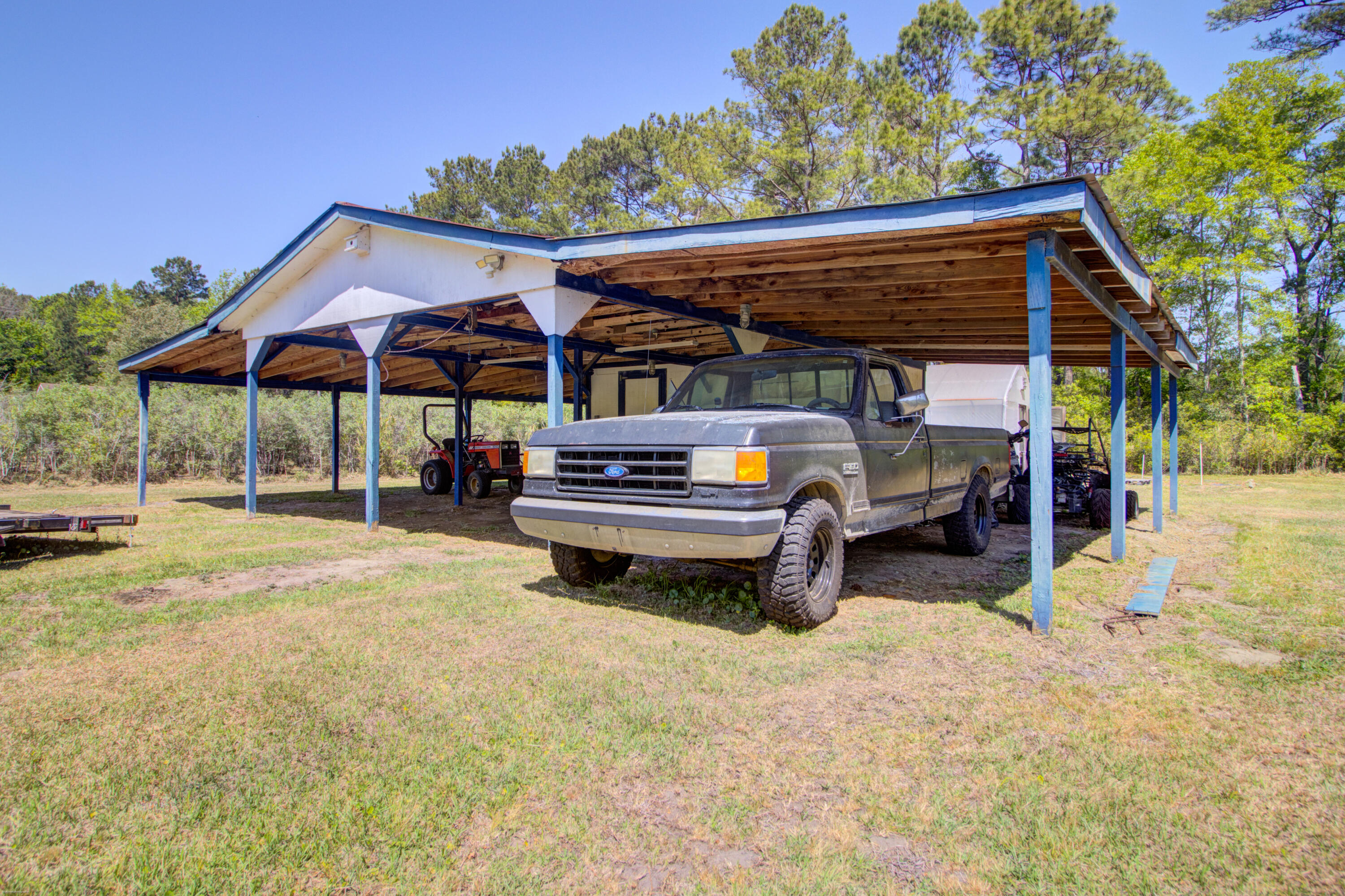 9760 State Rd S-10-1336 McClellanville, SC 29458 - Photo 65 of 98 Packing shed-upclose2