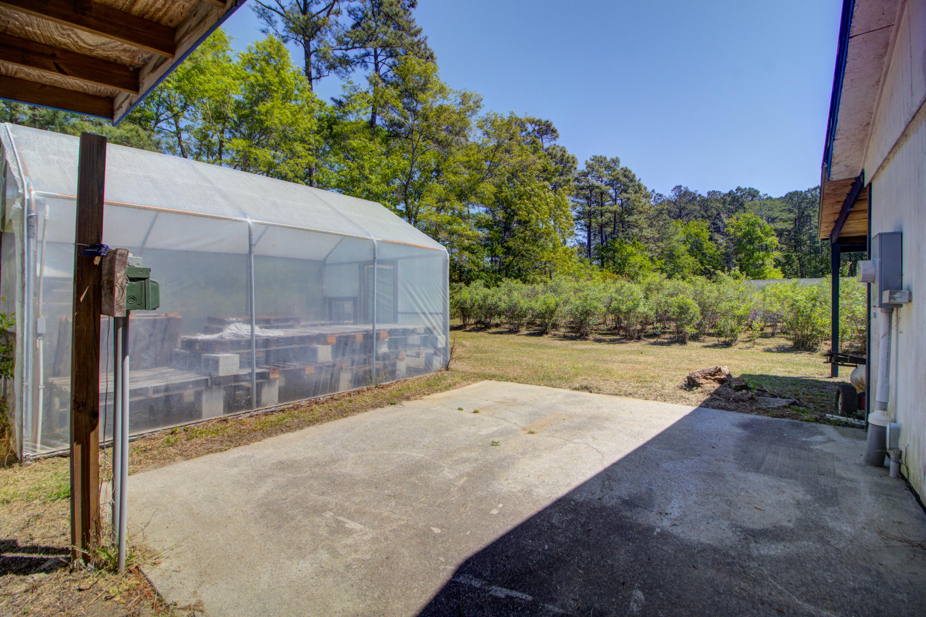 9760 State Rd S-10-1336 McClellanville, SC 29458 - Photo 71 of 98 Packing shed-patio