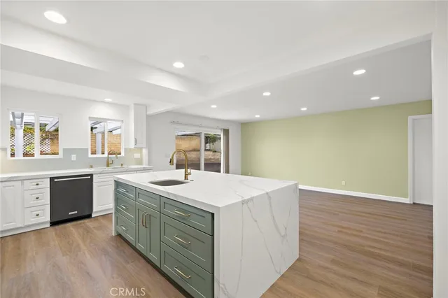 a kitchen with a sink and cabinets