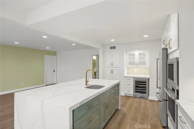 a bathroom with a sink a vanity and a mirror