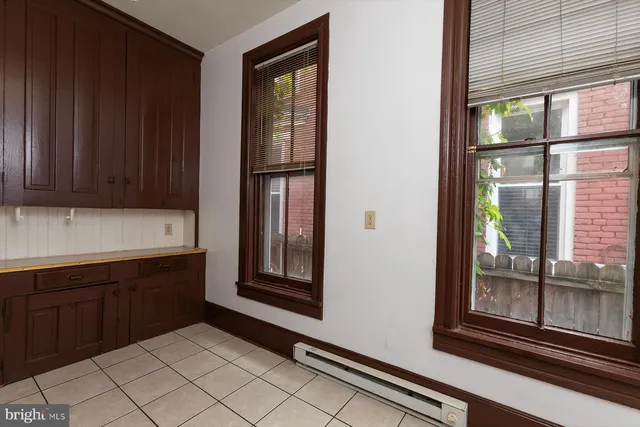 a kitchen with a sink and a window