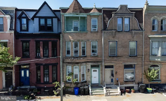 a front view of a building with street view