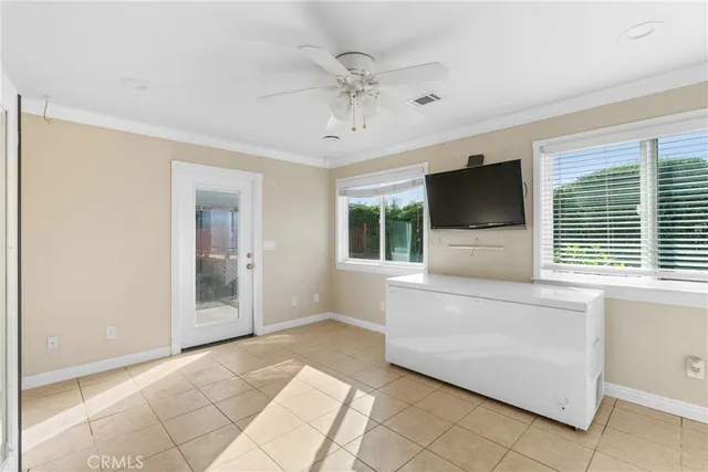 a living room with a flat screen tv and a fireplace