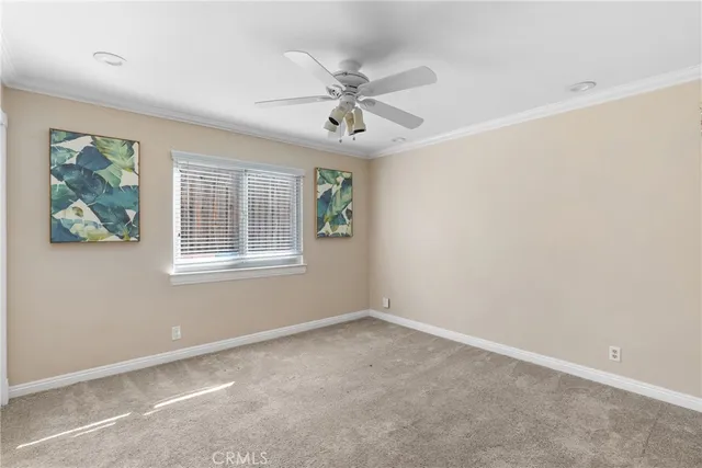 a view of a sink and dishwasher with wooden cabinet