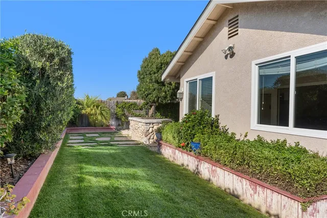 a house view with a garden space