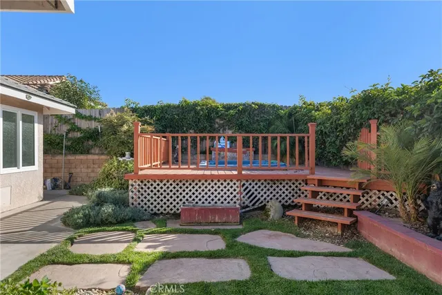 a view of a chairs and table in patio