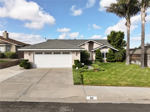an aerial view of a house with a garden