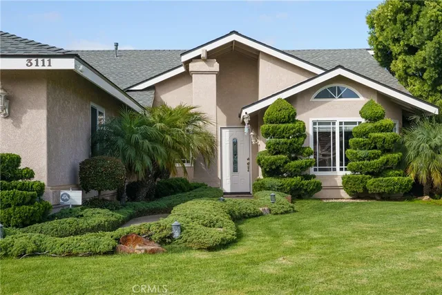 a front view of a house with garden