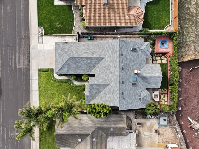an aerial view of residential houses with outdoor space and river