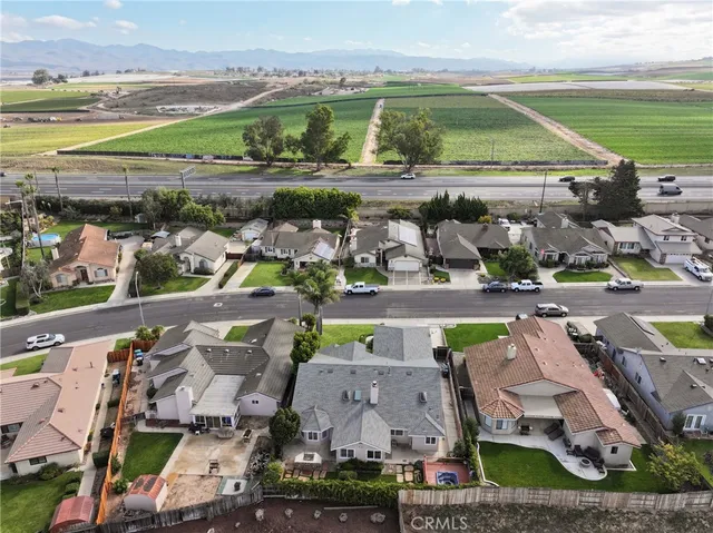 an aerial view of a house with a garden