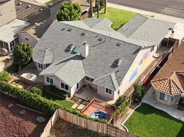 an aerial view of a house with a garden