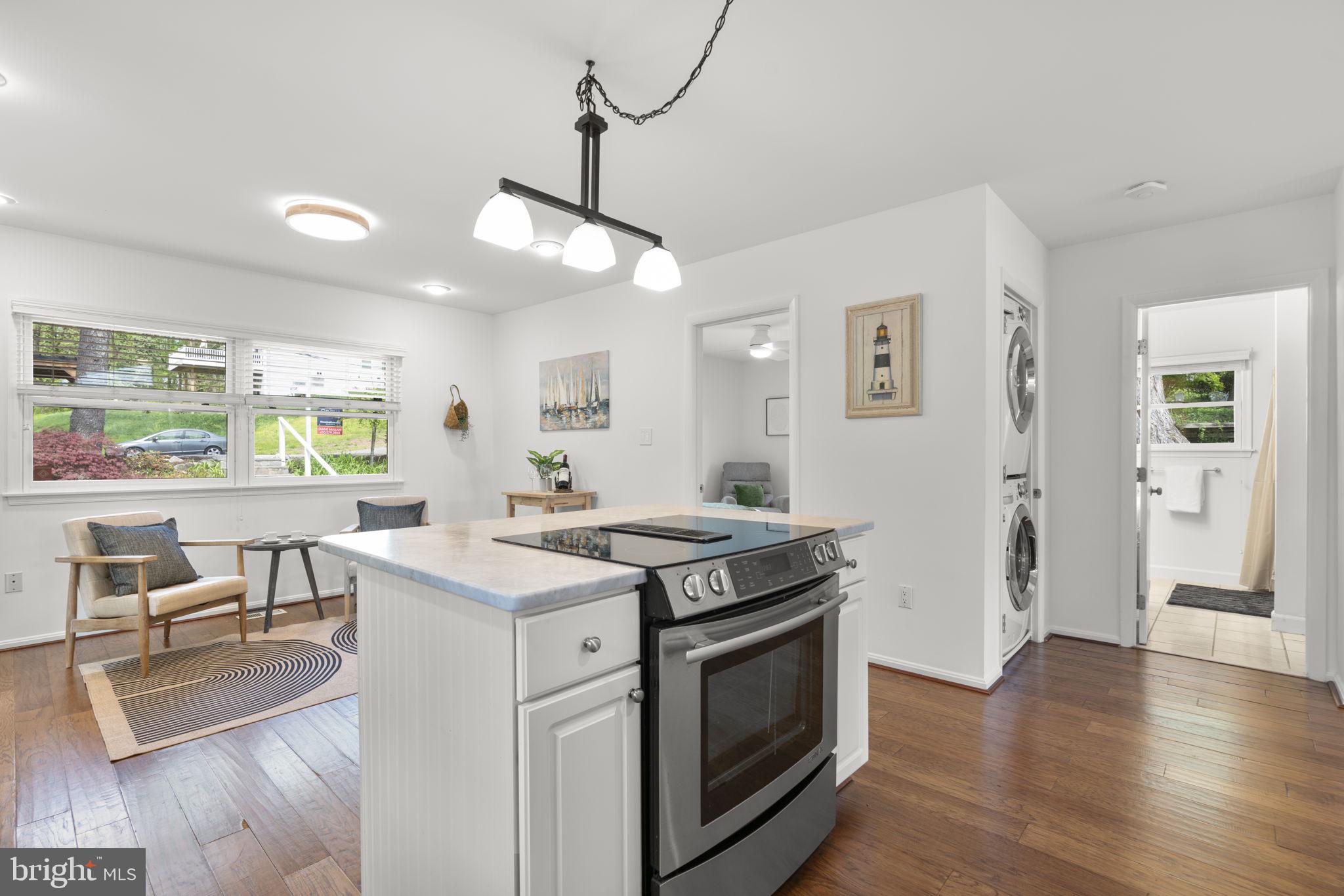 25 Leeland Road Edgewater, MD 21037 - Photo 9 of 48 a open kitchen with stainless steel appliances granite countertop a stove and a wooden floors