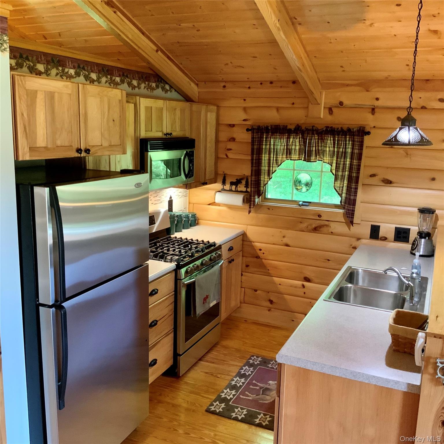 66 Milton Smith Road Long Eddy, NY 12760 - Photo 8 of 25 The functional kitchen offers generous workspace and beautiful woodland views.