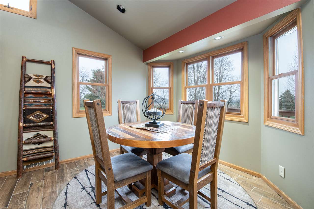 12410 Beaverton Road Poplar Grove, IL 61065 - Photo 13 of 37 a view of a dining room with furniture window and wooden floor