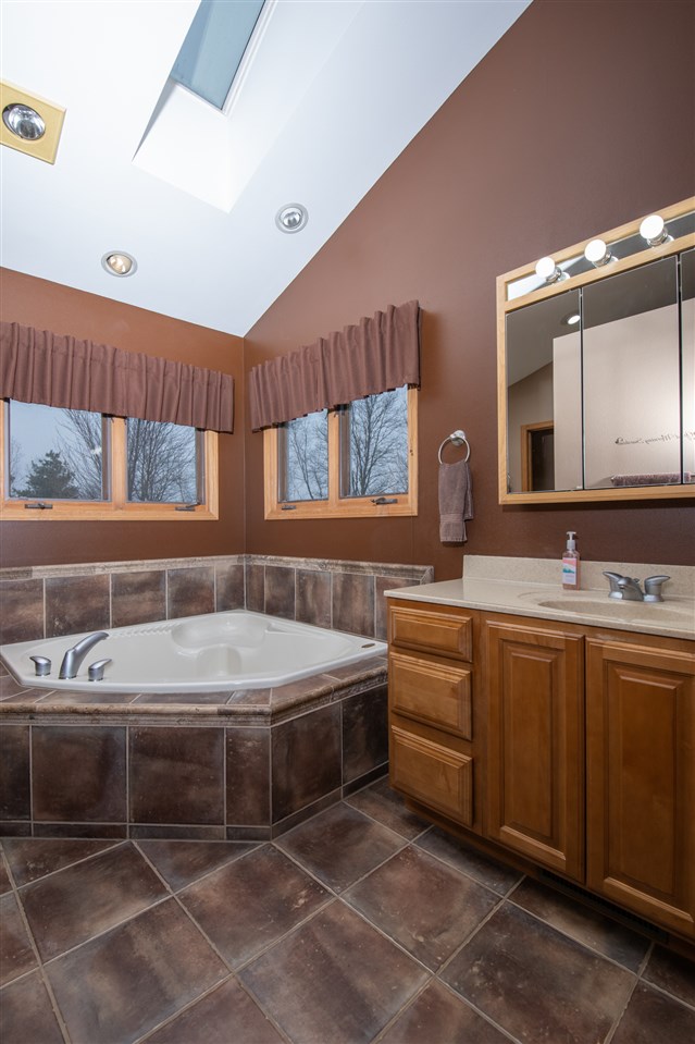 12410 Beaverton Road Poplar Grove, IL 61065 - Photo 17 of 37 a bathroom with a sink and a mirror