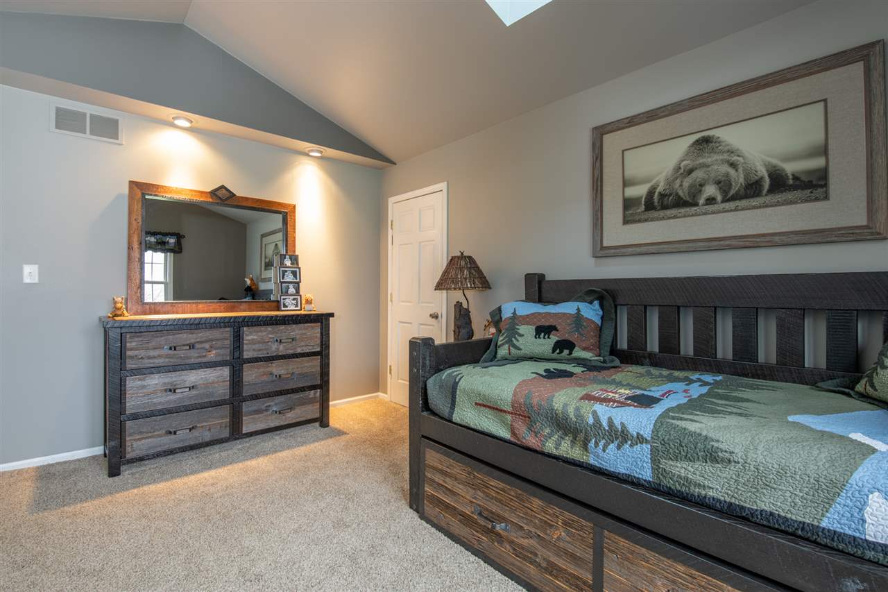 12410 Beaverton Road Poplar Grove, IL 61065 - Photo 19 of 37 a bedroom with a bed and a dresser
