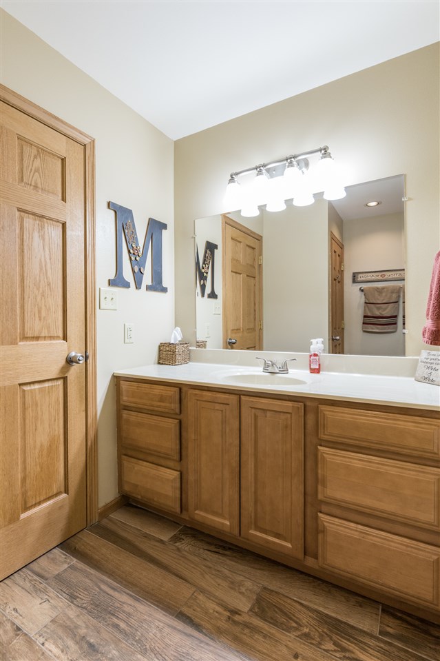 12410 Beaverton Road Poplar Grove, IL 61065 - Photo 20 of 37 a bathroom with a sink and a mirror