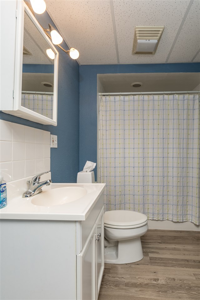 12410 Beaverton Road Poplar Grove, IL 61065 - Photo 30 of 37 a bathroom with a sink a toilet and mirror