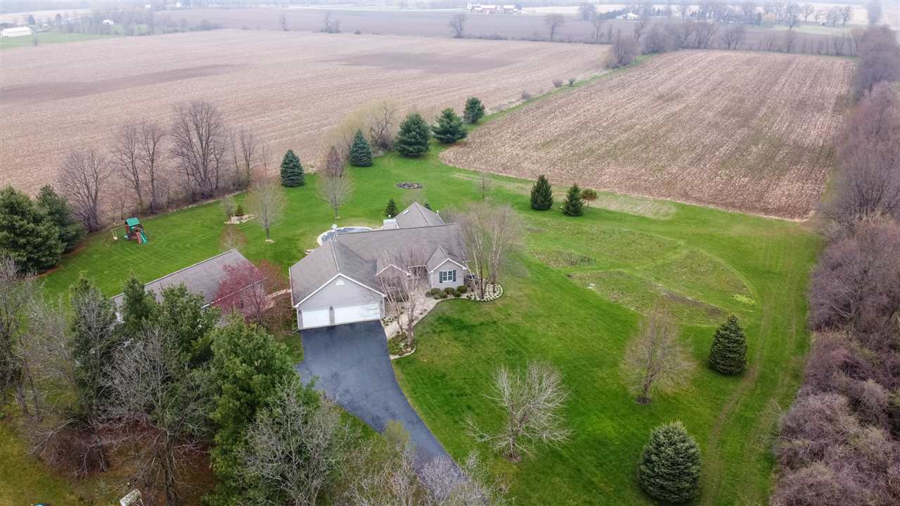 12410 Beaverton Road Poplar Grove, IL 61065 - Photo 3 of 37 a view of a garden with plants and large trees