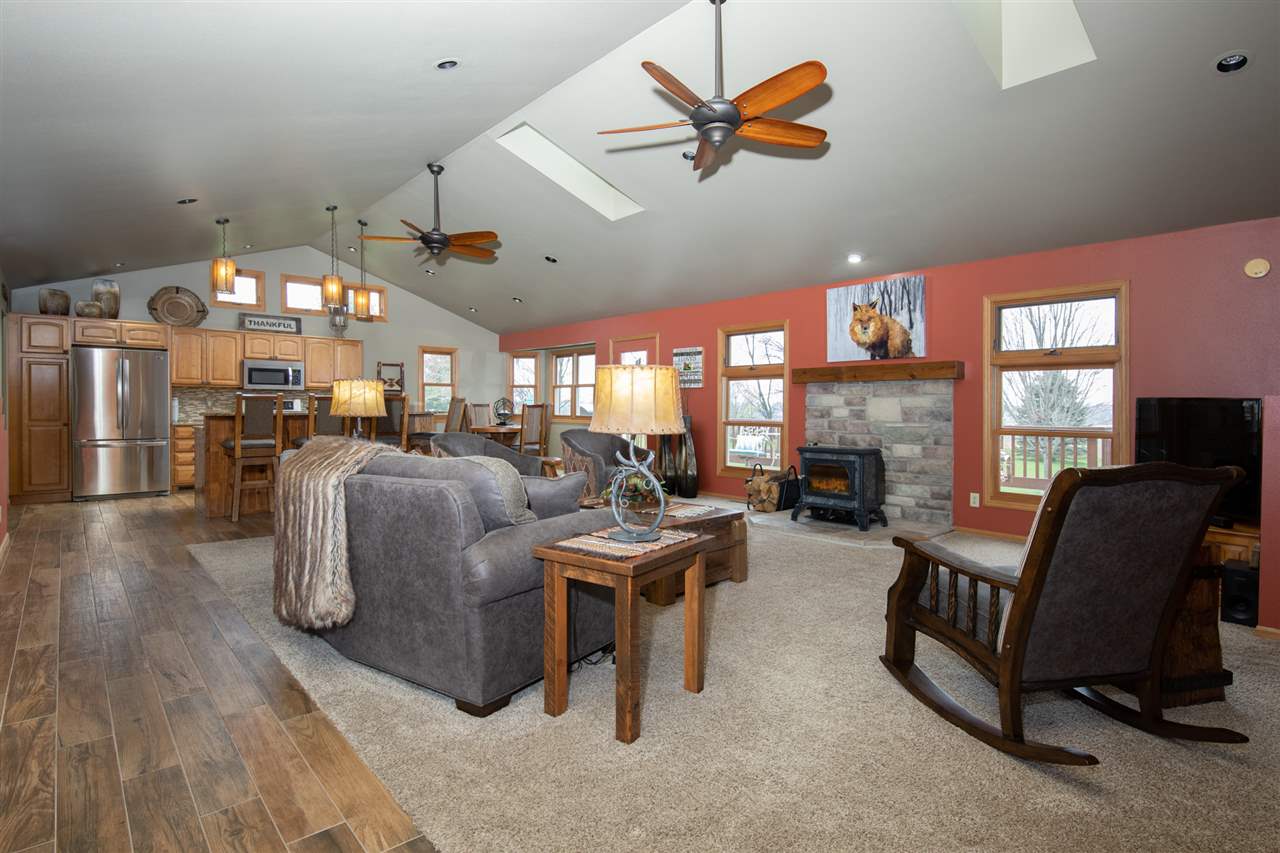 12410 Beaverton Road Poplar Grove, IL 61065 - Photo 5 of 37 a living room with furniture a fireplace and a flat screen tv
