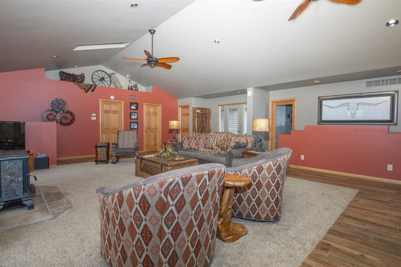 12410 Beaverton Road Poplar Grove, IL 61065 - Photo 6 of 37 a living room with furniture a chandelier and a rug