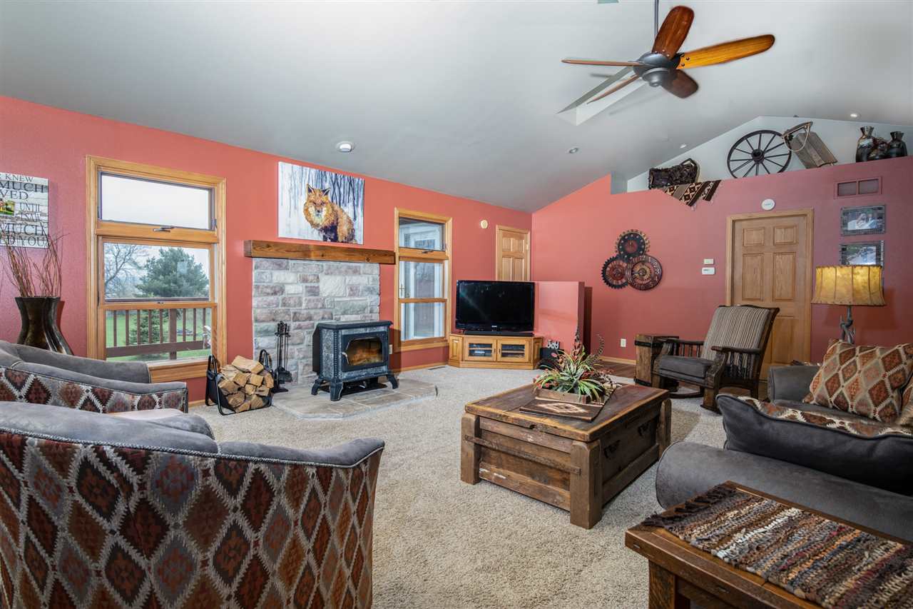 12410 Beaverton Road Poplar Grove, IL 61065 - Photo 8 of 37 a living room with furniture a rug and a fireplace