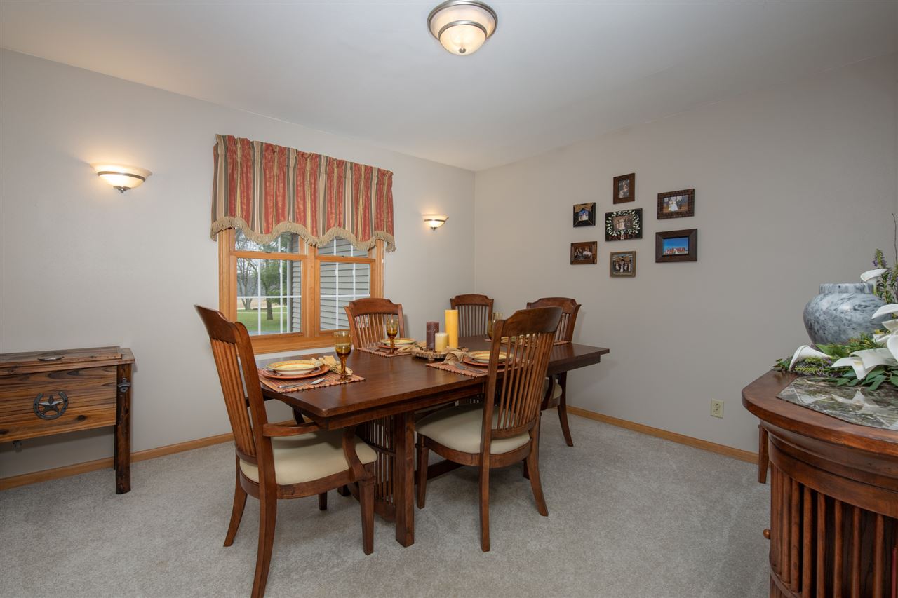12410 Beaverton Road Poplar Grove, IL 61065 - Photo 9 of 37 a view of a dining room with furniture