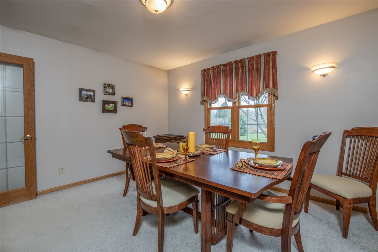 12410 Beaverton Road Poplar Grove, IL 61065 - Photo 10 of 37 a view of a dining room with furniture and window