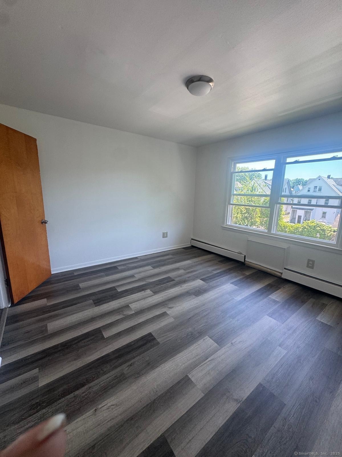 169 Birdseye Street, Unit C7 Bridgeport, CT 06604 - Photo 2 of 4 a view of an empty room with a window