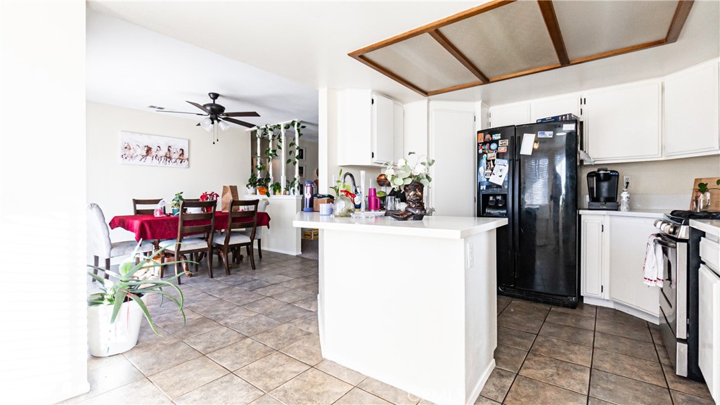 22993 Eyota Road Apple Valley, CA 92308 - Photo 13 of 38 a view of a kitchen with appliances and cabinets