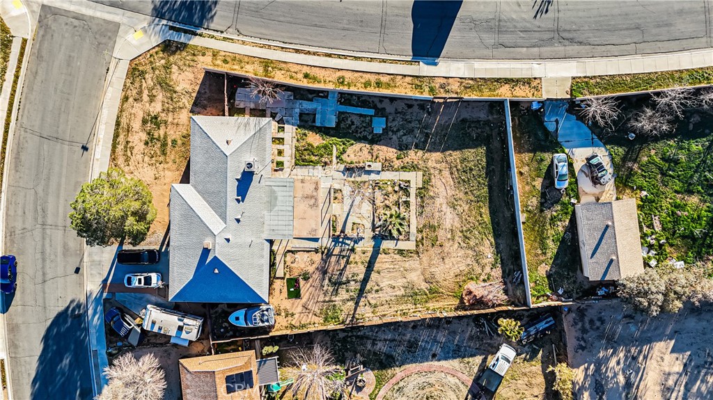 22993 Eyota Road Apple Valley, CA 92308 - Photo 37 of 38 a view of walk in closet with clothes and plants