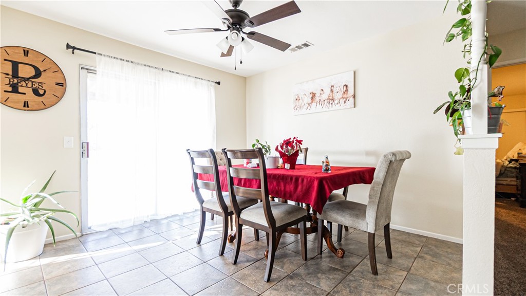 22993 Eyota Road Apple Valley, CA 92308 - Photo 8 of 38 a view of a dining room with furniture