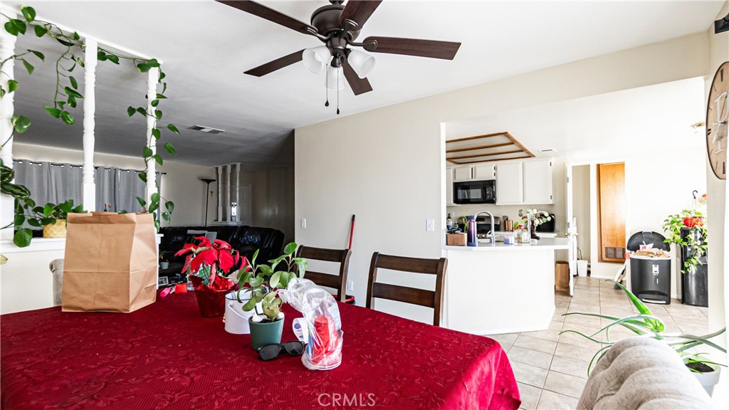 22993 Eyota Road Apple Valley, CA 92308 - Photo 9 of 38 a living room with furniture and wooden floor