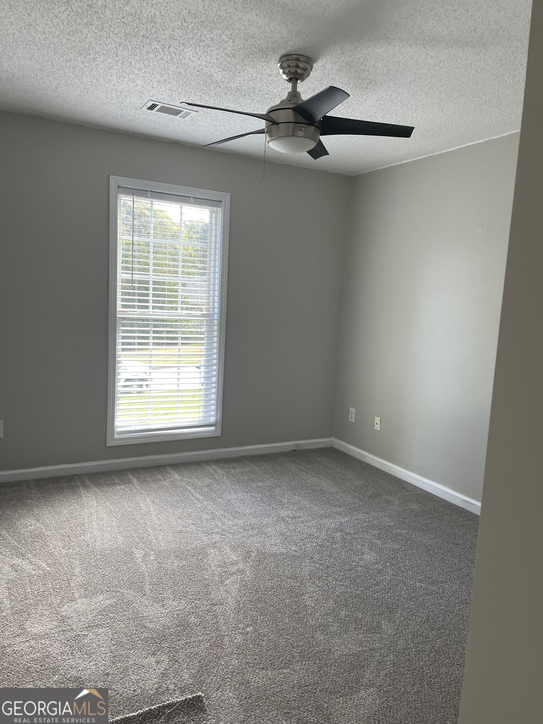 364 Lokey's Ridge Road Bethlehem, GA 30620 - Photo 8 of 13 Third bedroom with ceiling fan, closet and new carpet.