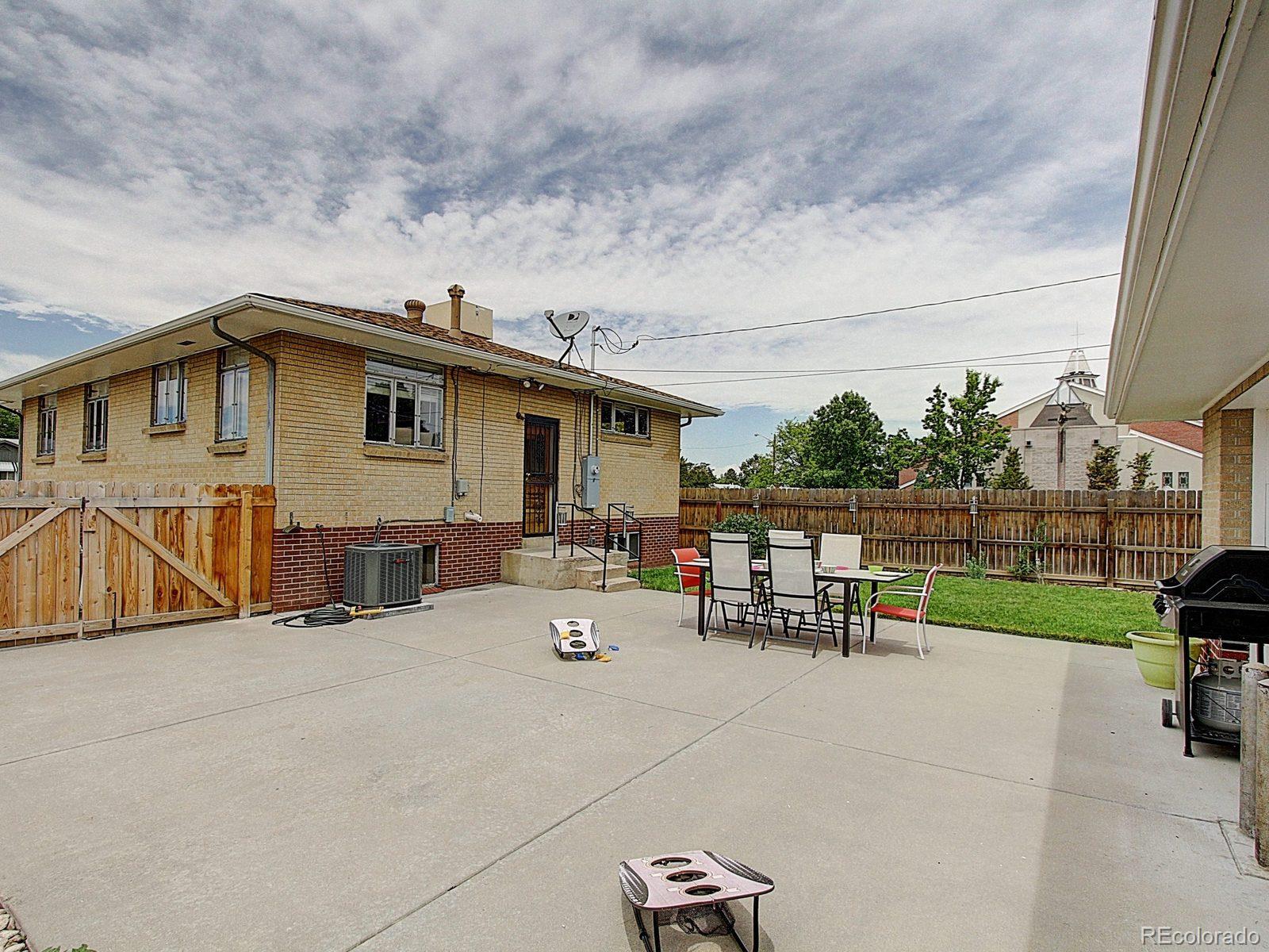 3840 Pierce Street Wheat Ridge, CO 80033 - Photo 26 of 32 a view of a house with a patio