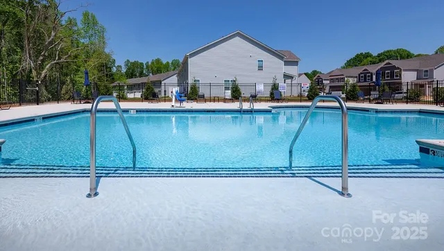 a view of a house with roof deck and sitting area