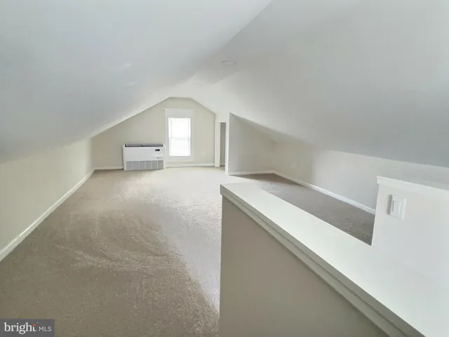 an aerial view of a house with backyard