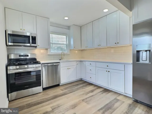 a view of a kitchen with electric appliances