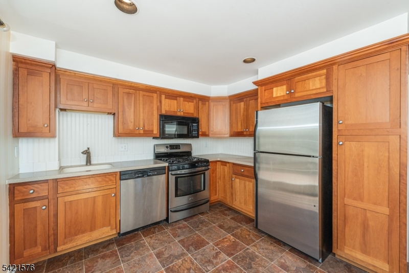 10 Butler Pass Mount Tabor, NJ 07878 - Photo 2 of 19 a kitchen with stainless steel appliances granite countertop a refrigerator a stove a sink and dishwasher
