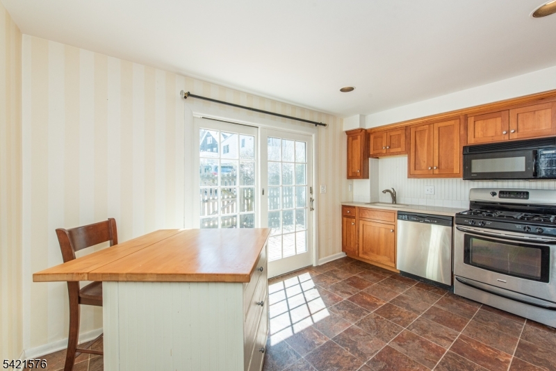 10 Butler Pass Mount Tabor, NJ 07878 - Photo 4 of 19 a kitchen with stainless steel appliances granite countertop a stove a sink and a microwave