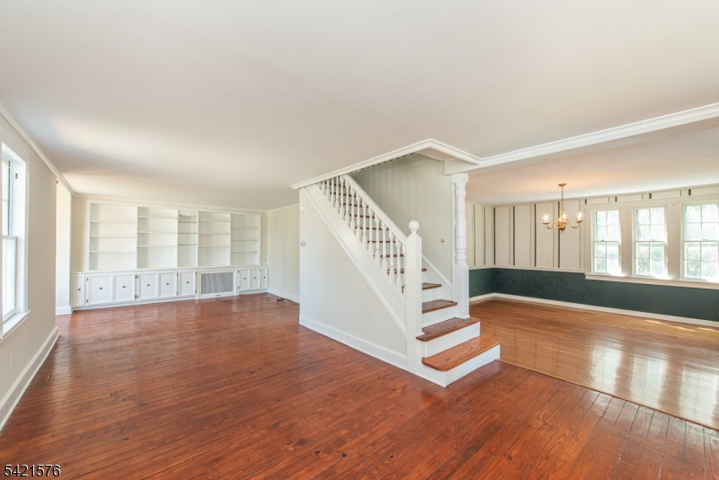 10 Butler Pass Mount Tabor, NJ 07878 - Photo 5 of 19 a view of an empty room with wooden floor and a window