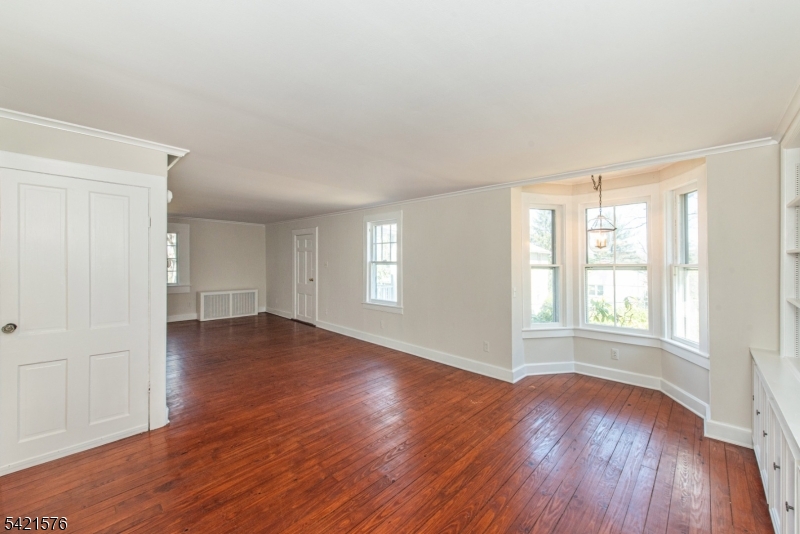 10 Butler Pass Mount Tabor, NJ 07878 - Photo 6 of 19 an empty room with wooden floor and windows