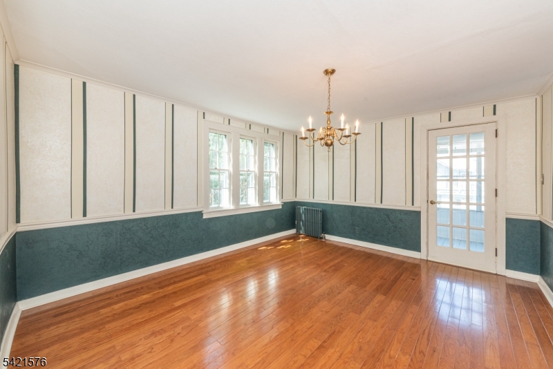 10 Butler Pass Mount Tabor, NJ 07878 - Photo 9 of 19 a view of an empty room with window and wooden floor