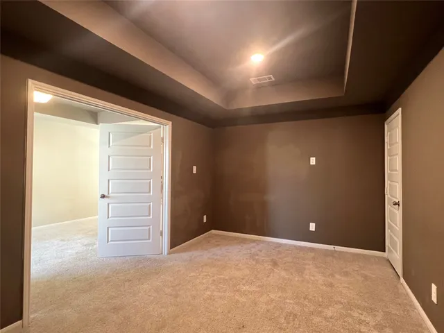 a bathroom with a bathtub shower sink vanity and toilet